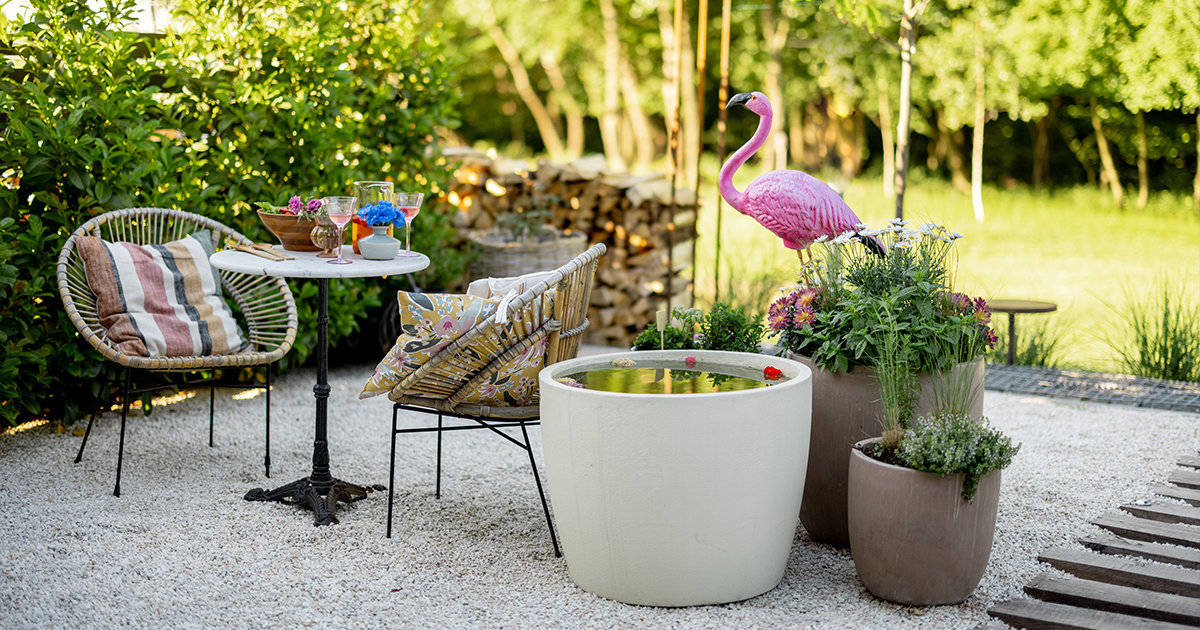 Backyard with pink flamingo and plants